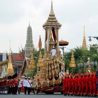 The Great Victory Chariot is pulled during the funeral procession for Thailand\'s late King Bhumibol Adulyadej before the Royal Cremation Ceremony in front of the Grand Palace in Bangkok Thursday. | REUTERS