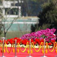 North Korean leader Kim Jong Un and his sister Kim Yo Jong attend an opening ceremony of a residential complex in Pyongyang on April 13. | REUTERS