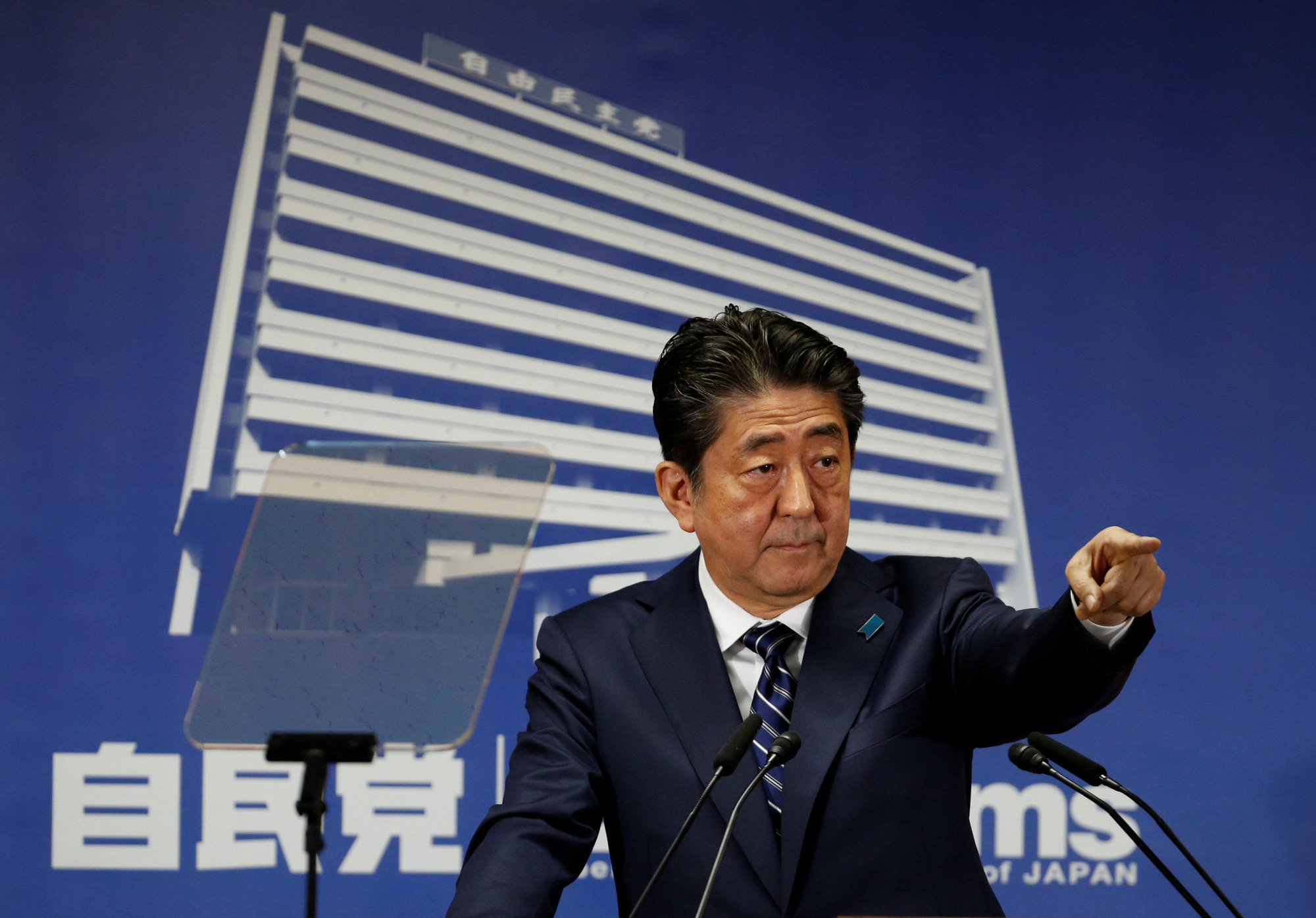 Prime Minister Shinzo Abe, who is also leader of the Liberal Democratic Party, is seen at a news conference at LDP headquarters in Tokyo on Monday. | REUTERS