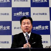 Constitutional Democratic Party of Japan Secretary-General Tetsuro Fukuyama speaks Sunday evening at the party\'s Tokyo election headquarters as vote counting for the day\'s Lower House election was being carried out. | REUTERS