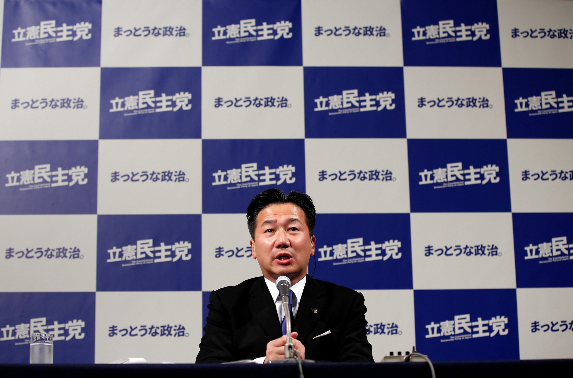 Constitutional Democratic Party of Japan Secretary-General Tetsuro Fukuyama speaks Sunday evening at the party's Tokyo election headquarters as vote counting for the day's Lower House election was being carried out. | REUTERS