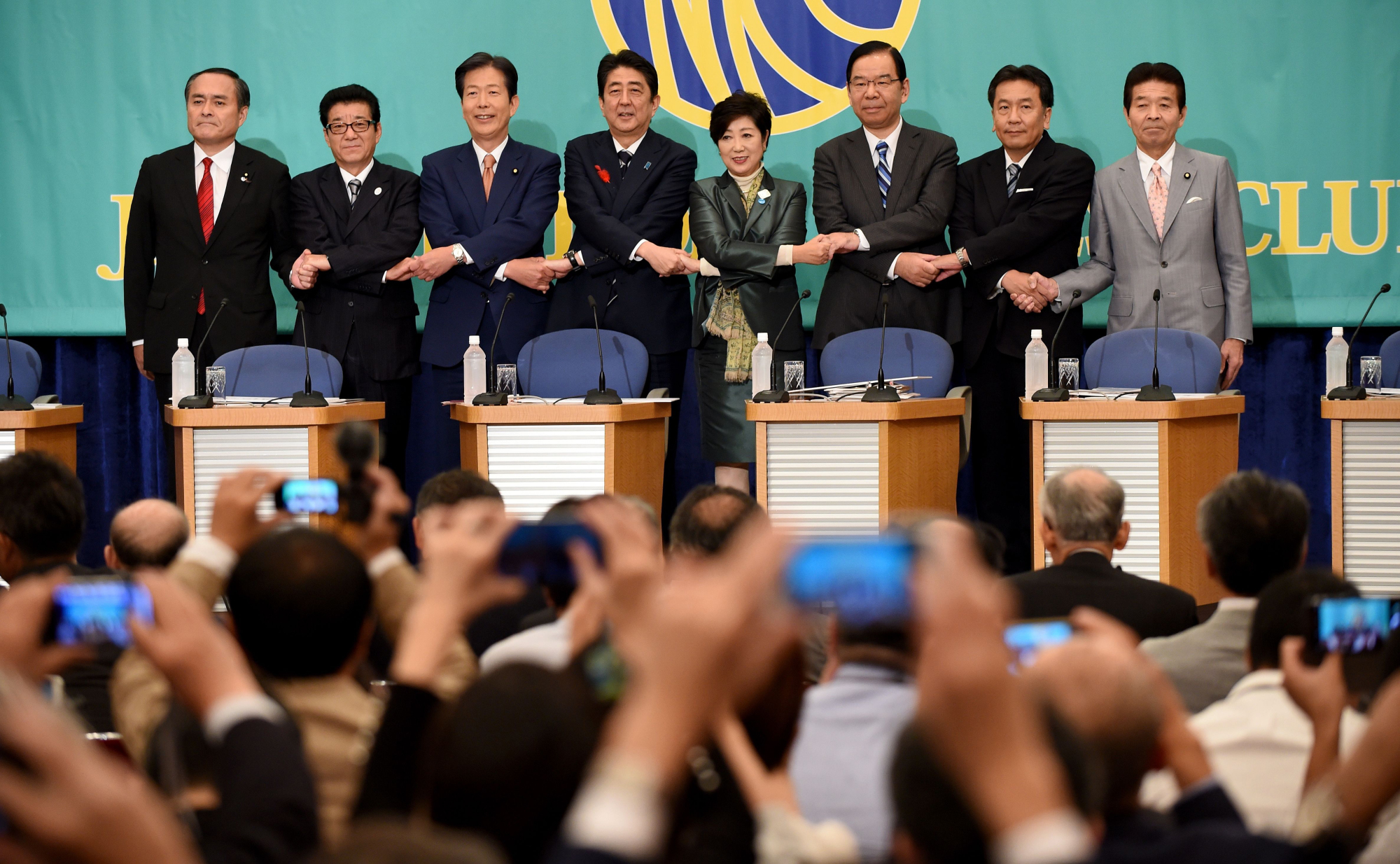 The leaders of Japan's major political parties pose for photographers at the Japan National Press Club in Tokyo on Sunday during a debate ahead of the Oct. 22 Lower House election. | AFP-JIJI