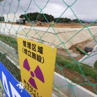 A new facility in the town of Okuma, Fukushima Prefecture, starts storing radioactive waste generated by the 2011 nuclear crisis on Saturday. | KYODO
