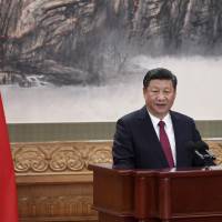 Chinese President Xi Jinping gives a speech during the introduction of the Communist Party of China\'s Politburo Standing Committee in Beijing\'s Great Hall of the People on Wednesday. | AFP-JIJI