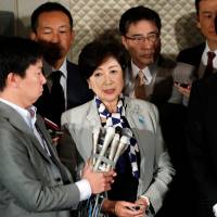 Tokyo Gov. Yuriko Koike, who is also head of the Kibo no To party, and Democratic Party leader Seiji Maehara, speak to reporters after their talks in Tokyo on Thursday. | REUTERS