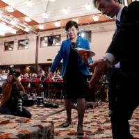 Tokyo Governor Yuriko Koike arrives for a news conference at the Japan National Press Club in Tokyo on Sept. 28. | REUTERS