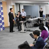 Seiji Maehara answers questions from reporters at the Democratic Party\'s headquarters in Tokyo on Monday. | KYODO