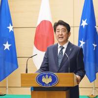 Visiting Micronesian President Peter Christian and Prime Minister Shinzo Abe hold a joint news conference following their talks Wednesday at the Prime Minister\'s Office in Tokyo. | KYODO