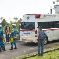 An ambulance arrives near the spot where 4-year-old Renki Fukumi was found safe in a forest in Ito, Shizuoka Prefecture, on Monday. | KYODO