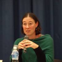 Alexandra Devine, a senior research officer at the Nossal Institute for Global Health in Australia, speaks at a symposium on sports for athletes with disabilities in Tokyo on Friday. | MIZUHO AOKI