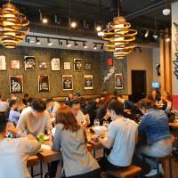 Customers sample Ippudo’s ramen at a new outlet that opened in July in Berkeley, California. | CHIKARANOMOTO HOLDINGS CO.