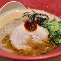 Ippudo’s signature Akamaru Shinaji ramen is served at its Gotanda outlet on Friday. | YOSHIAKI MIURA