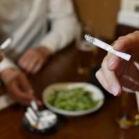 The government is mulling raising the tobacco tax to cover revenue shortfalls when it introduces lessened rates for daily necessities along with the expected consumption tax hike, sources said. | KYODO