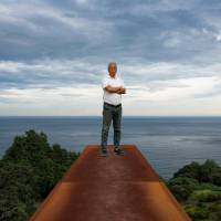 Home by the sea: Artist Hiroshi Sugimoto stands atop a 70-meter rectangular chamber made from CorTen weathering steel that starts underground and ends up as a sheer drop overlooking the ocean at the Enoura Observatory, Kanagawa Prefecture. It is angled to capture the winter solstice. | ROB GILHOOLY