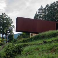 A 70-meter rectangular steel chamber juts out from a hill at the Enoura Observatory in Kanagawa Prefecture. | ROB GILHOOLY