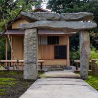 A stone torii gate stands at the entrance to a teahouse at the Enoura Observatory in Kanagawa Prefecture. | ROB GILHOOLY