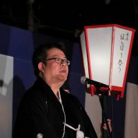 Shinichiro Yamashita, chair of the Yuwaku Onsen Tourist Association, greets 15,000 festival attendees and anime fans from the steps of a local shrine. | © YUWAKU ONSEN TOURISM ASSOCIATION