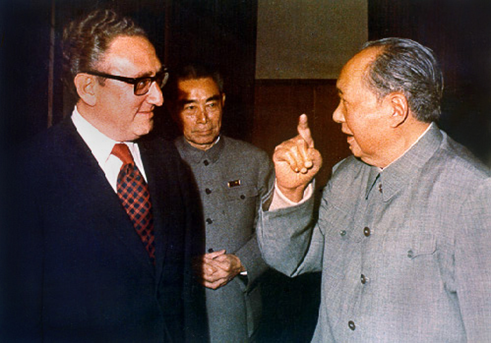Power games: Henry Kissinger (left), Zhou Enlai (center) and Mao Zedong speak in Beijing in the early 1970s. | PUBLIC DOMAIN