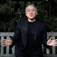 Nobel winner: Author Kazuo Ishiguro poses for the media outside his home in London on Oct. 5, following the announcement that he has won the Nobel Prize in literature. | REUTERS