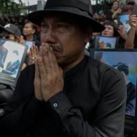 Well-wishers pay their respects during a funeral rehearsal for late Thai King Bhumibol Adulyadej near the Grand Palace in Bangkok on Saturday. | REUTERS