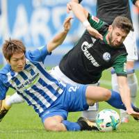 Hertha Berlin\'s Genki Haraguchi (left) will miss two matches after receiving a red card last weekend against Schalke. | KYODO