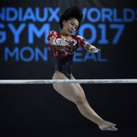 Mai Murakami competes on the uneven bars during the World Artistic Gymnastics Championships in Montreal on Friday. | USA TODAY / VIA REUTERS