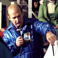 Dick Button was a longtime commentator for ABC Sports. He is seen here working at the 1980 Lake Placid Games in New York. | CC BY-SA 2.0 / DAN LUNDBERG