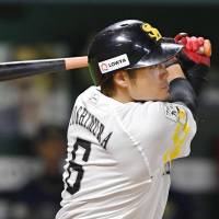 The Hawks\' Yuki Yoshimura bashes a sayonara home run in the 12th inning against the Buffaloes on Friday night at Yafuoku Dome. Fukuoka SoftBank defeated Orix 4-3. | KYODO