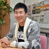 Sprinter Yoshihide Kiryu smiles during an interview earlier this week at Toyo University\'s Hakusan Campus. | YOSHIAKI MIURA