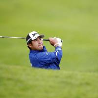 Hideki Matsuyama plays out of the bunker during the Genesis Open in Pacific Palisades, California, in February. | AP