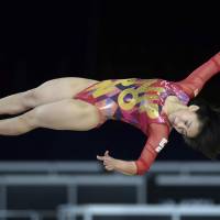 Mai Murakami performs her floor routine during the artistic gymnastics world championships on Sunday in Montreal. Murakami became the first Japanese woman to win gold in the event. | AP