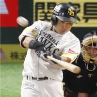 SoftBank\'s Akira Nakamura connects for a home run against Rakuten in the sixth inning of Game 4 of the PL Climax Series Final Stage on Saturday. | KYODO