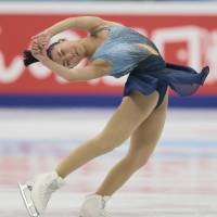 Kaori Sakamoto competes in the short program at the Cup of Russia in Moscow on Friday night. Sakamoto is in fourth place going into Saturday\'s free skate. | AP