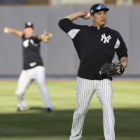 Yankees hurler Masahiro Tanaka works out on Tuesday at Yankee Stadium. | AP