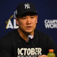 Yankees hurler Masahiro Tanaka speaks to reporters on Thursday in Houston. | USA TODAY / VIA REUTERS