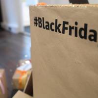 A hashtag is displayed inside Amazon\'s Black Friday pop-up space in London Tuesday. | REUTERS