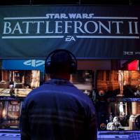 Attendees play \"Star Wars: Battlefront II,\" made by Electronic Arts, during June\'s E3 Electronic Entertainment Expo in Los Angeles. | BLOOMBERG