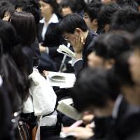 Pay for new graduates in Japan is said to be far below their counterparts in the United States. | BLOOMBERG