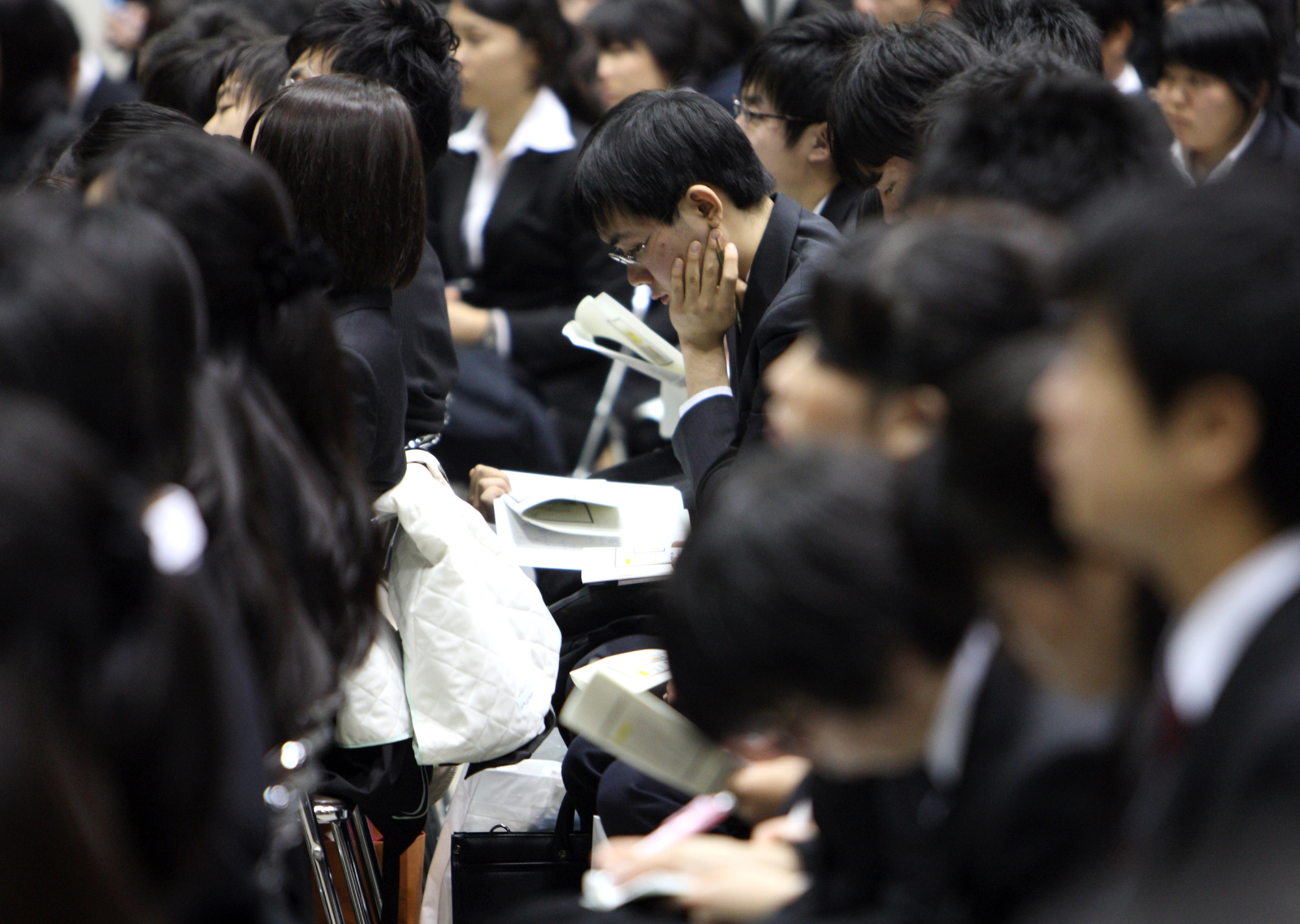 Pay for new graduates in Japan is said to be far below their counterparts in the United States. | BLOOMBERG