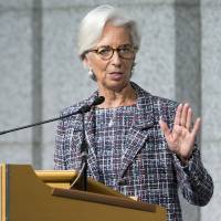 Christine Lagarde, managing director of the International Monetary Fund, delivers a speech in Tokyo on Wednesday during an event marking the 20th anniversary of the IMF\'s regional office for Asia and the Pacific. | BLOOMBERG