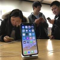 With Apple Inc. selling its first phone boasting an organic light-emitting diode display — a sharp, vibrant screen that uses less energy — Japan Steel Works is counting on that being good for its own bottom line. | AP