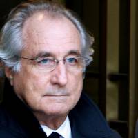 Accused swindler Bernard Madoff exits the Manhattan federal court house in New York in 2009. | REUTERS