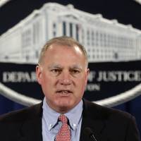 Connecticut Attorney General George Jepsen speaks at the Justice Department in Washington in 2013. On Tuesday, Jepsen and 45 of his colleagues sought to expand a federal antitrust lawsuit against generic drugmakers to include more manufacturers and medications, as well as senior executives at two companies. | AP