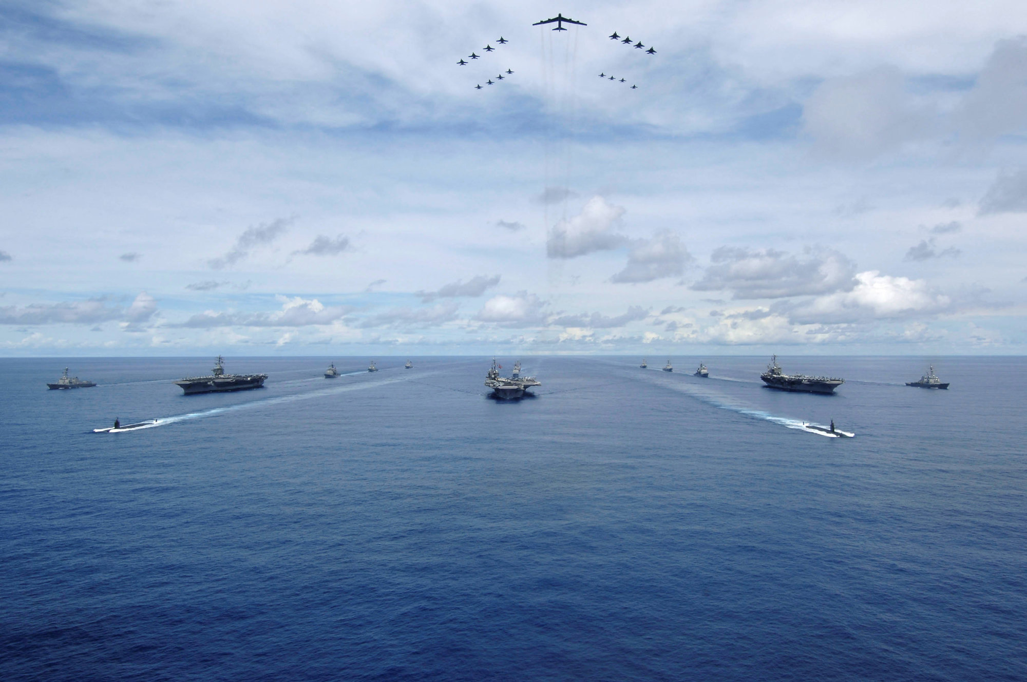 The USS Nimitz, USS Kitty Hawk and USS John C. Stennis Carrier Strike Groups transit in formation during a joint photo exercise during the Valiant Shield 2007 drills in the Pacific Ocean in this 2007 handout photo. The aerial formation consists of aircraft from the carrier strike groups as well as Air Force aircraft. | MASS COMMUNICATION SPECIALIST SEAMAN STEPHEN W. ROWE / U.S. NAVY / HANDOUT / VIA REUTERS