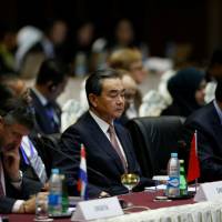 Chinese Foreign Minister Wang Yi attends the 13th Asia Europe Foreign Ministers Meeting in Naypyitaw, Myanmar, on Monday. | REUTERS