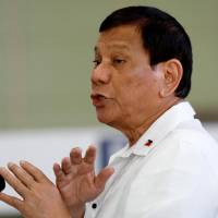 Philippine President Rodrigo Duterte gestures Wednesday during a news conference before his departure to Da Nang in Vietnam for the Asia Pacific Economic Cooperation (APEC) summit, at Ninoy Aquino International Airport in Pasay, metro Manila. | REUTERS