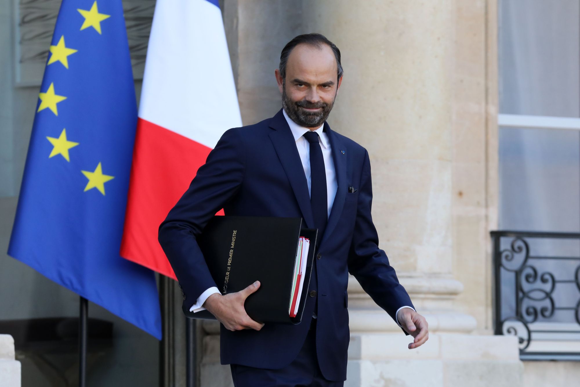 French Prime Minister Edouard Philippe leaves the Elysee Palace in Paris after the weekly Cabinet meeting Wednesday. In a memo to ministers the day before, he banned gender-inclusive writing. | AFP-JIJI