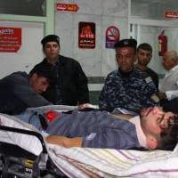 An earthquake victim is aided at Sulaimaniyah Hospital Sunday in Sulaimaniyah, Iraq. Officials in Iran reports at least 30 dead and Iraqi officials report six. The U.S. Geological Survey said the magnitude 7.3 temblor was centered 30 km (19 miles) southwest of Halabja, Iraq, near the border with Iran. | AFP-JIJI
