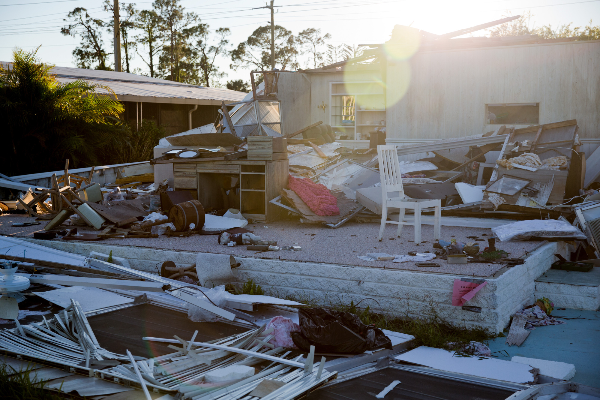 A mobile home damaged by Hurricane Irma is seen at the Riviera Colony neighborhood in Naples, Florida, on Oct. 30. A donors' conference held in New York on Tuesday pledged over &#36;2 billion in aid to help Caribbean nations to the south of Florida recover from hurricanes that have recently hit the region. | BLOOMBERG