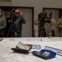 German police present stolen diaries and other items belonging to former Beatle John Lennon that were recovered, during a news conference in Berlin Tuesday. | REUTERS